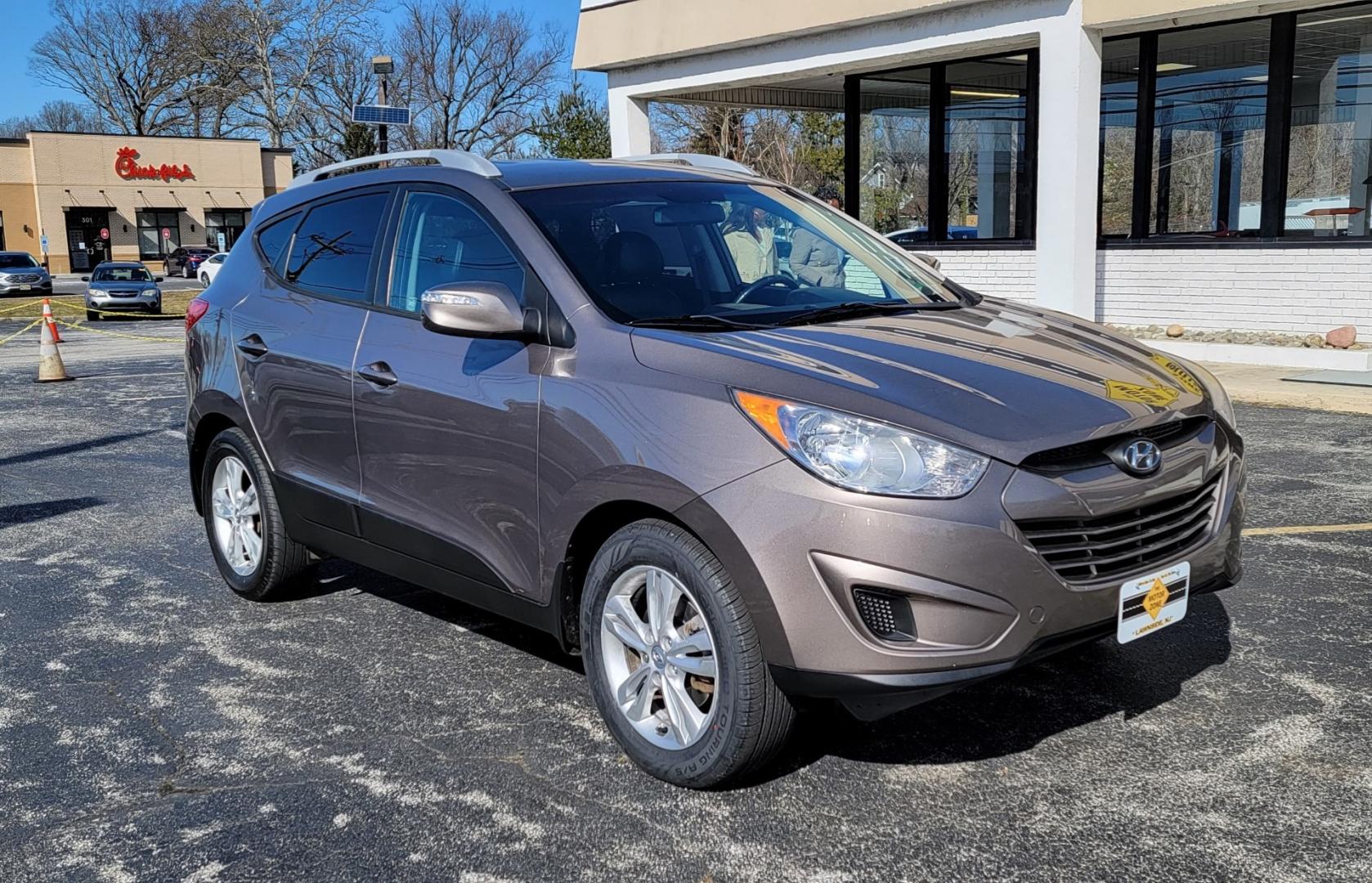 2012 Brown /Black Hyundai Tucson Limited (KM8JUCAC7CU) with an 4-Cyl, PZEV, 2.4 Liter engine, Automatic transmission, located at 341 N White Horse Pike, Lawnside, NJ, 08045, (856) 262-9500, 39.855621, -75.027451 - Photo#0